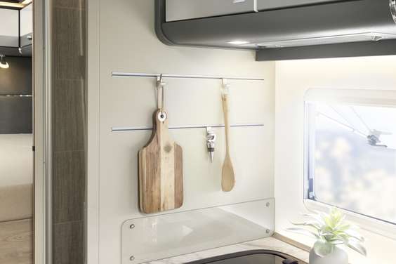 The kitchen boasts a range of practical and stylish solutions, such as the rail system