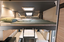 Need additional berths? The Low Profile models can be equipped with an electrically adjustable pull-down bed above the seating lounge, providing two additional berths that take up no space during the day.