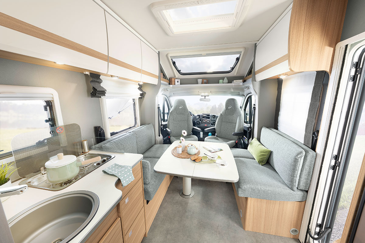 The new T 6762 dispenses with a fixed bed in in favour of a large pull-down bed. This layout creates a incredibly generous feeling of space with plenty of head/elbow room and a wonderfully spacious kitchen. • T 6762